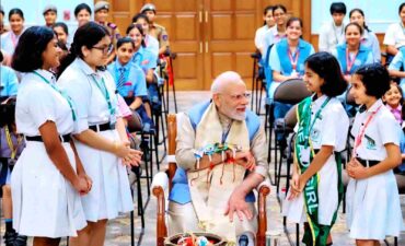 Prime Minister Narendra Modi gets a unique Rakhi tied by the children of DPS, Knowledge Park 5, and appreciates their initiatives in the field of AI and environment.